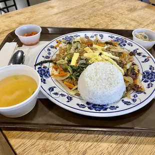 a plate of food on a tray