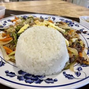a plate of rice and vegetables