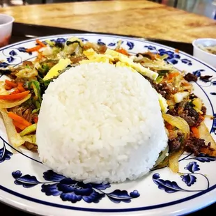 a plate of rice and vegetables