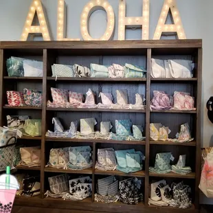 Love this wall.  The pouches and the lit "ALOHA" is everything!