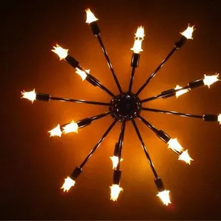 a circular light fixture with flames coming out of it
