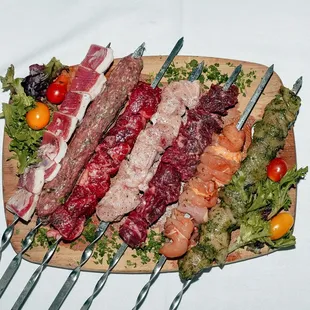 a platter of meat and vegetables