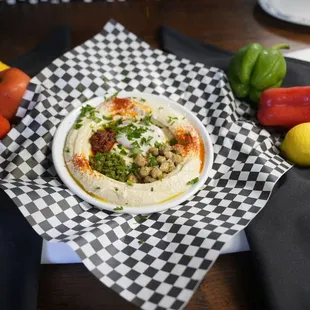 a bowl of hummus and vegetables