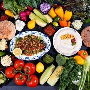 a variety of vegetables and dips