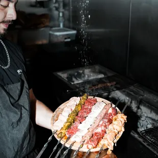 a man holding a pizza