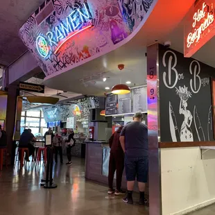 people standing in line at the counter