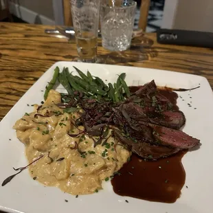 Elk with scalloped potatoes and green beans