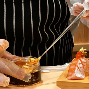 a chef preparing sushi