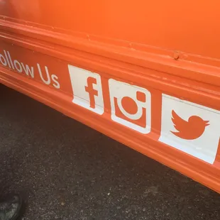 follow us on the side of a bus