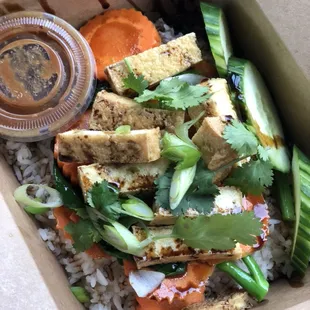 Vegetarian version of Khao Mun Gai: Stirred fried vegetables and fried tofu served with steamed rice and ginger-garlic sauce.