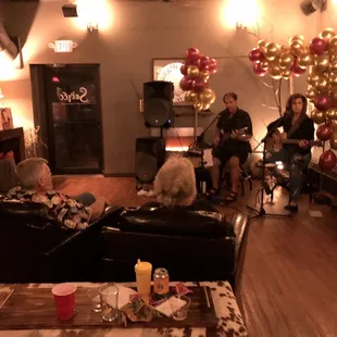 a group of people sitting in a living room