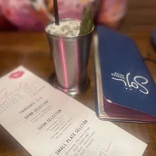 a menu and a drink