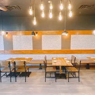 a dining area with tables and chairs