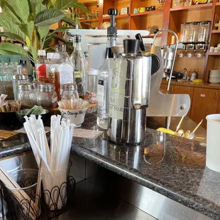 a counter with a variety of drinks