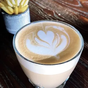 a cup of coffee and a plant