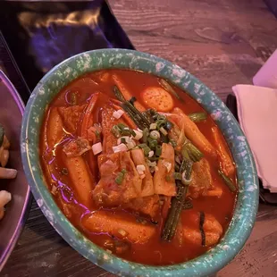 a bowl of stew and a bowl of noodles