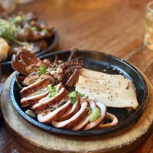 Grilled Whole Squid with Oyster Mushrooms.