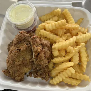 Fried jerk chicken and fries.