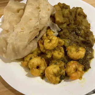 Buss-up-shut curry shrimp curry potato curry baigan .
