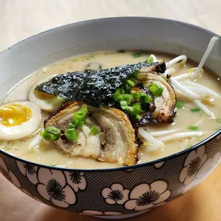 a bowl of ramen with an egg