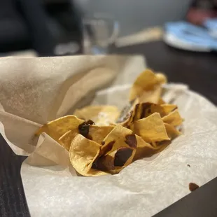 Complementary chips drizzled with the Mole sauces they serve