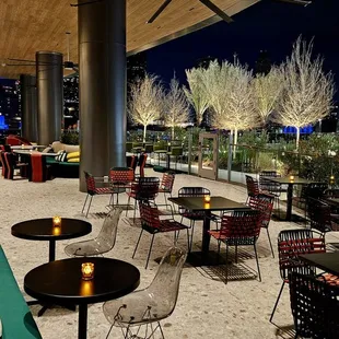 a view of a rooftop restaurant at night