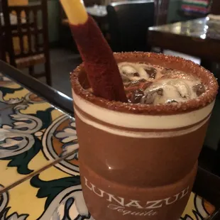 Drink with tamarind garnish