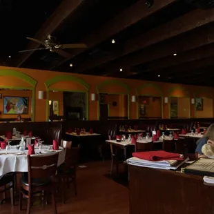 a dining room with tables and chairs