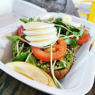 Horizon Toast on gluten-free bread with sunflower microgreens sourced locally from the Microgreen Depot, hard boiled egg, and Roma tomatoes