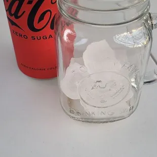 Serve canned soda with ice in Mason jar