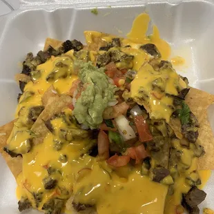 1/2 size order beef fajita nachos (I did NOT like was their yellow queso cheese )