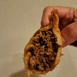 Inside the empanada filled with seasoned ground beef