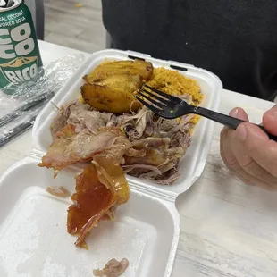 Pernil.  It&apos;s actually pork that they roast. Famous Puerto Rican dish. The skin was so crunchy!, plantain &amp; rice and beans