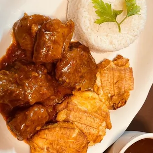 a plate of meat and rice