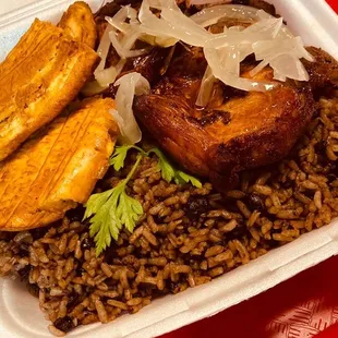 a plate of rice and meat