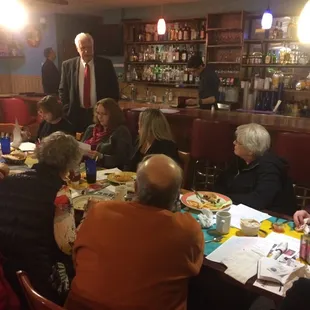 a group of people sitting around a table