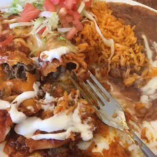Steak enchiladas with rice and beans. Yummy yummy