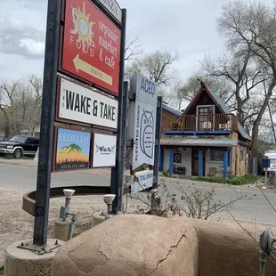 a sign in front of a building