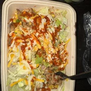 chicken, yellow rice, black beans, lettuce, corn salsa,  and cheese