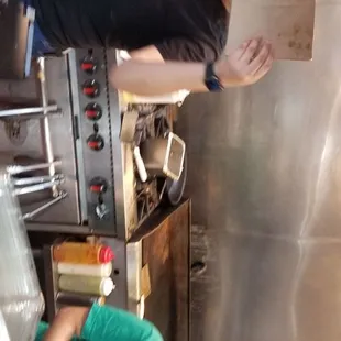 Counter area with employee covering her face after telling me the other lady was the manager