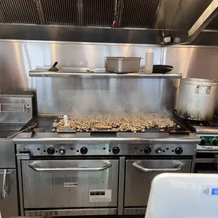 a kitchen with a stove and oven