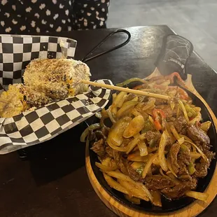 Steak fajitas and Elote (Mexican corn)