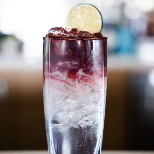 a close up of a drink in a tall glass