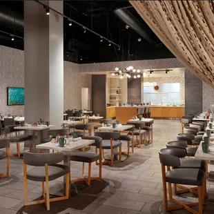 a dining area with tables and chairs
