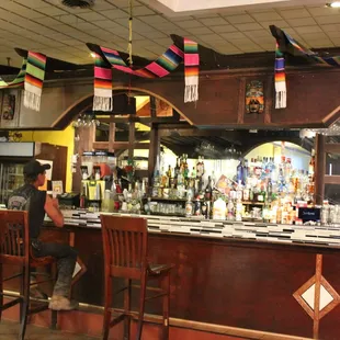 a man sitting at the bar