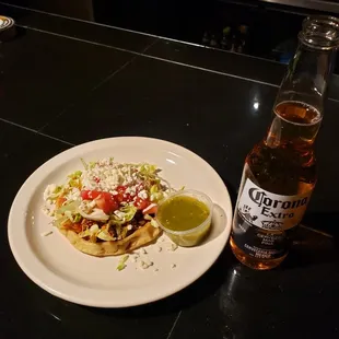 Sope ,thick home made tortilla fried and topped with beans, choice of beef or chicken ,lettuce, fresco cheese and sour cram