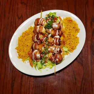 Camarones momias,Shrimp wrap with bacon, and topped with cheese sauce