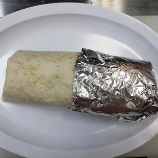 Big burrito :14" flour tortilla, stuffed with rice,beans choice of beef  or chicken, lettuce ,cheese and sour cream