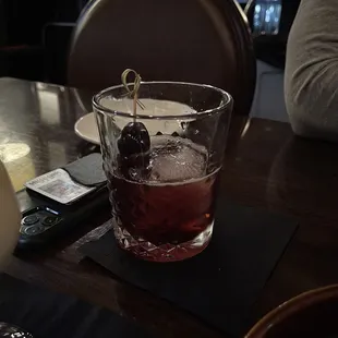 a drink in a glass on a table