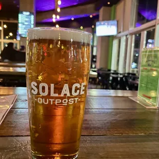 a pint of beer on a table